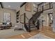 Elegant staircase with metal railings and an open design, leading to the upper level at 10826 Evergold Way, Highlands Ranch, CO 80126