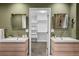 Elegant bathroom with double sinks and an open view into a walk-in closet at 21859 Grandview Ave, Golden, CO 80401