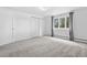 Bright bedroom featuring neutral carpeting, white walls, and a window that brings in natural light at 21859 Grandview Ave, Golden, CO 80401