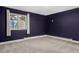 A simple bedroom design with a large window provides natural light and backyard views at 21859 Grandview Ave, Golden, CO 80401