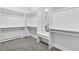 A spacious walk-in closet features built-in shelving, ample storage space and a vanity area at 21859 Grandview Ave, Golden, CO 80401