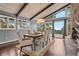 Elegant dining room with large windows offering scenic views and a chandelier at 21859 Grandview Ave, Golden, CO 80401
