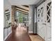 Foyer featuring hardwood floors, console table, and open view of the living area at 21859 Grandview Ave, Golden, CO 80401