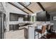 Open concept kitchen with stainless steel appliances and stylish dark wood cabinets at 21859 Grandview Ave, Golden, CO 80401