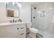 Stylish bathroom showcasing a vanity, sleek fixtures, and a glass-enclosed shower, combining modern design and functionality at 901 Delphi Dr, Lafayette, CO 80026