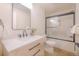 Modern bathroom featuring a vanity with quartz countertop, sleek fixtures, and stylish sliding glass shower doors at 901 Delphi Dr, Lafayette, CO 80026