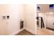 A utility area with laundry hookups and convenient access to the staircase and entry, blending function and design at 901 Delphi Dr, Lafayette, CO 80026