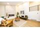 Inviting living room with modern fireplace, cozy seating, and stylish decor, offering a comfortable and elegant space at 901 Delphi Dr, Lafayette, CO 80026