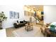 Spacious living room featuring modern decor and a staircase leading to an upper level at 901 Delphi Dr, Lafayette, CO 80026