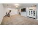 Spacious finished basement with carpet, exercise equipment, and ample space for a home gym or recreation area at 13367 W Montana Pl, Lakewood, CO 80228