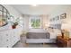 Bright bedroom with neutral decor, large windows, plush carpet, and stylish furnishings for a cozy atmosphere at 13367 W Montana Pl, Lakewood, CO 80228