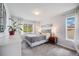 Bright bedroom with neutral decor, large windows, plush carpet, and stylish furnishings for a cozy atmosphere at 13367 W Montana Pl, Lakewood, CO 80228