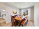 Cozy dining room features a rustic wooden table and bench, ample natural light, and modern decor at 13367 W Montana Pl, Lakewood, CO 80228