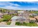 Charming single-story home boasts a well-manicured lawn, mature trees, and an attached two-car garage at 13367 W Montana Pl, Lakewood, CO 80228