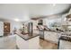 Spacious kitchen with white cabinets, stainless steel appliances, a center island, and modern countertops at 13367 W Montana Pl, Lakewood, CO 80228