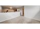 Spacious living room featuring neutral carpet and walls, offering a versatile space at 13367 W Montana Pl, Lakewood, CO 80228