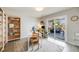 Bright home office area with a bookshelf, desk, and sliding glass doors leading to an outdoor deck at 13367 W Montana Pl, Lakewood, CO 80228
