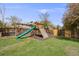 Fun backyard playground with a slide and climbing wall, perfect for outdoor adventures at 13367 W Montana Pl, Lakewood, CO 80228