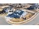 A well-manicured lawn surrounds this home, complemented by a fenced yard, pergola, and solar panels at 885 Delechant Dr, Erie, CO 80516