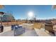 Backyard featuring outdoor seating area with fire pit and grill perfect for entertaining at 885 Delechant Dr, Erie, CO 80516