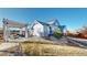 This backyard features an outdoor entertaining area, fire pit and beautiful landscaping at 885 Delechant Dr, Erie, CO 80516