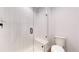 Clean bathroom showcasing a glass-enclosed shower, a modern toilet, and contemporary tile work at 885 Delechant Dr, Erie, CO 80516