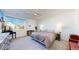 Well-lit bedroom featuring a comfortable bed, modern furnishings, and a calming atmosphere at 885 Delechant Dr, Erie, CO 80516