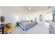 Cozy bedroom with a bed, desk, lamps, large mirror and ample natural light at 885 Delechant Dr, Erie, CO 80516