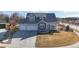 Charming two-story home with three-car garage, covered porch, and well-maintained lawn at 885 Delechant Dr, Erie, CO 80516