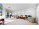 Spacious living room offering plush seating, large windows, railing, and an open concept design at 885 Delechant Dr, Erie, CO 80516