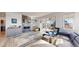 Living room boasting sleek fireplace, built-in shelving, and sliding doors to the patio at 885 Delechant Dr, Erie, CO 80516