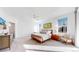 Bright main bedroom with ample natural light, ceiling fan, and neutral color palette at 885 Delechant Dr, Erie, CO 80516