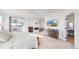 Large main bedroom with a fireplace, deck, and a mounted television at 885 Delechant Dr, Erie, CO 80516