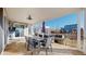 Relax on this covered patio featuring an outdoor dining area and views of the community at 885 Delechant Dr, Erie, CO 80516