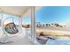Inviting front porch features a hanging chair and lovely views of the neighborhood at 885 Delechant Dr, Erie, CO 80516