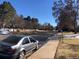 Street view showing the sidewalk lined with street parking at 2045 S Monroe St, Denver, CO 80210