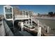 Daytime outdoor shot of a train pulling into a multi-story station at 2045 S Monroe St, Denver, CO 80210