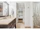 Bright bathroom featuring a vanity with dark cabinetry and a bedroom view at 3039 N Milwaukee St, Denver, CO 80205