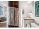 Stylish bathroom with modern vanity, decorative towels, and dark wood door at 3039 N Milwaukee St, Denver, CO 80205