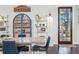 Inviting dining area with modern table and chairs, a bar cabinet, and stylish decor at 3039 N Milwaukee St, Denver, CO 80205