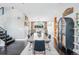 Spacious dining room with hardwood floors, modern furnishings, and a view into the kitchen at 3039 N Milwaukee St, Denver, CO 80205