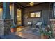 Cozy front porch with seating, stylish decor, and an inviting entrance at 3039 N Milwaukee St, Denver, CO 80205