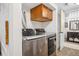 Laundry room with modern appliances and storage at 3039 N Milwaukee St, Denver, CO 80205