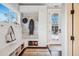 Well-organized mudroom with built-in storage, a bench, and plenty of natural light at 3039 N Milwaukee St, Denver, CO 80205