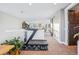 Spacious recreation room equipped with exercise equipment and connected to sitting areas with a sliding barn door at 3039 N Milwaukee St, Denver, CO 80205