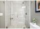 Modern shower with glass door and sleek white horizontal tiling at 3039 N Milwaukee St, Denver, CO 80205