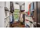 Organized walk-in closet featuring ample storage space with shelving and rods for clothing and accessories at 3039 N Milwaukee St, Denver, CO 80205