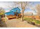 A large backyard with deck offers an ideal space for entertainment, play, and relaxation at 4922 S Rifle Ct, Aurora, CO 80015