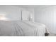 Bedroom featuring neutral walls and carpet, with closet doors, and an ensuite door visible at 4922 S Rifle Ct, Aurora, CO 80015