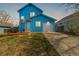 Charming home with manicured lawn, features a driveway leading to a garage at 4922 S Rifle Ct, Aurora, CO 80015